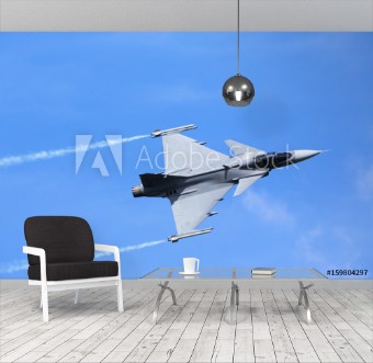 Afbeeldingen van Modern jet fighter flying against a blue sky White smoke trail